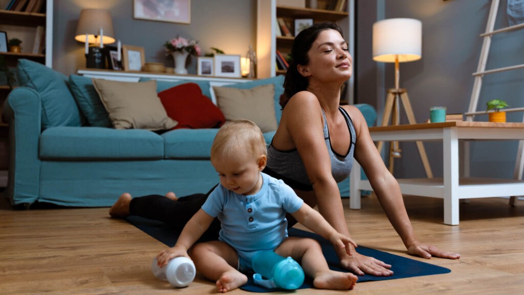 Mom stretching with a new baby